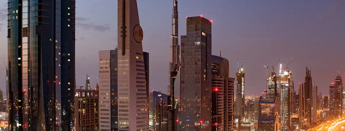 Sheikh Zayed Road towers and Burj Khalifa at dusk, Dubai